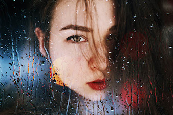 double-exposure image of Taya Ivanova's self portrait and raindrops