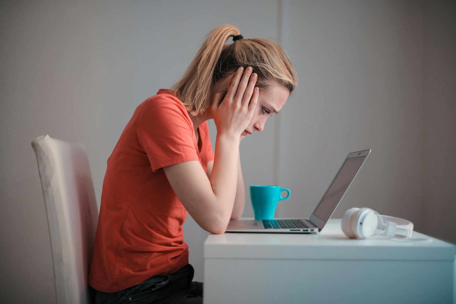 Worried woman checking her banking information on her computer