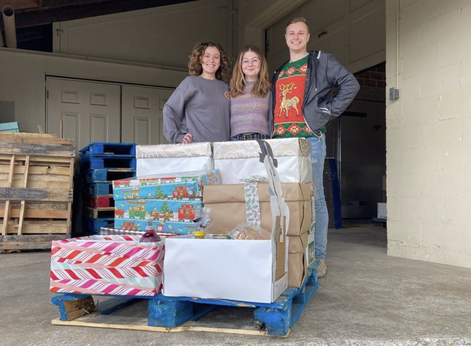 University students and Kiana, a GivePulse Ambassador, at a holiday food box drive Kiana helped host as part of the GivePulse Ambassador program.