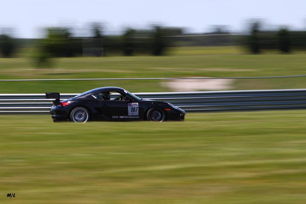 Porsche Cayman 987.2 turning laps at a track