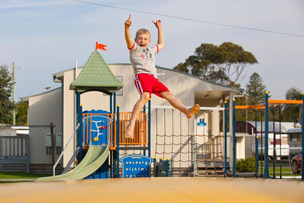 A kid enjoying the playground