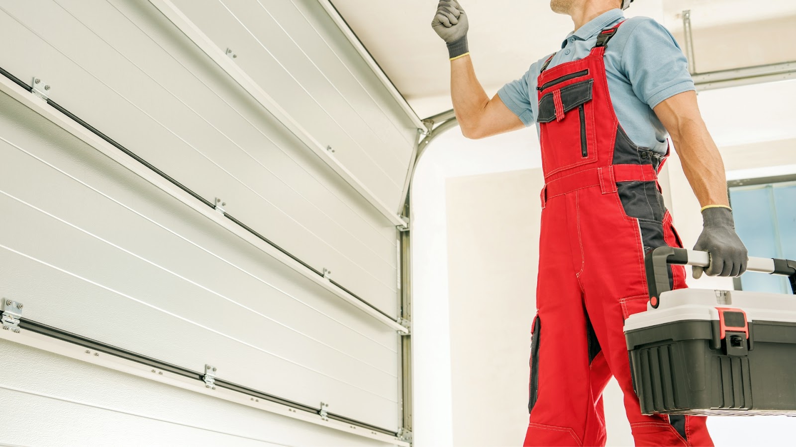 A technician checking the system to prevent garage door mishaps from happening