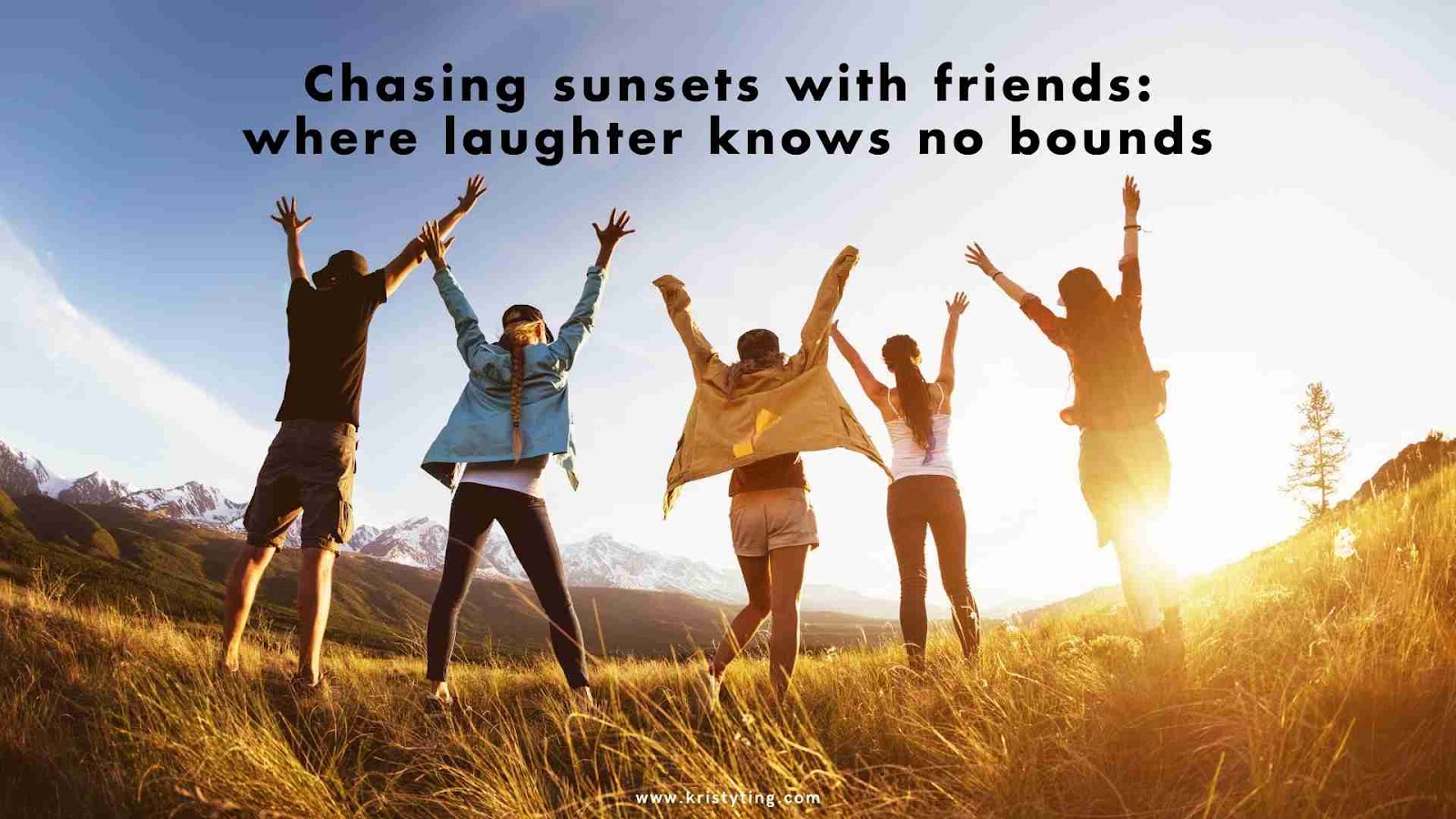 A group of friends jumping joyfully in a field at sunset.