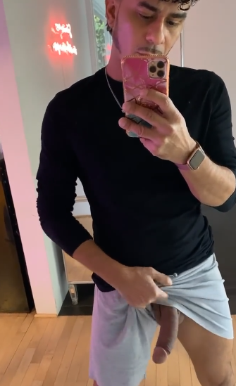 Cesar Xes pulling up his athletic shorts to reveal freeballing cock in an iphone mirror selfie for xxx gay porn content