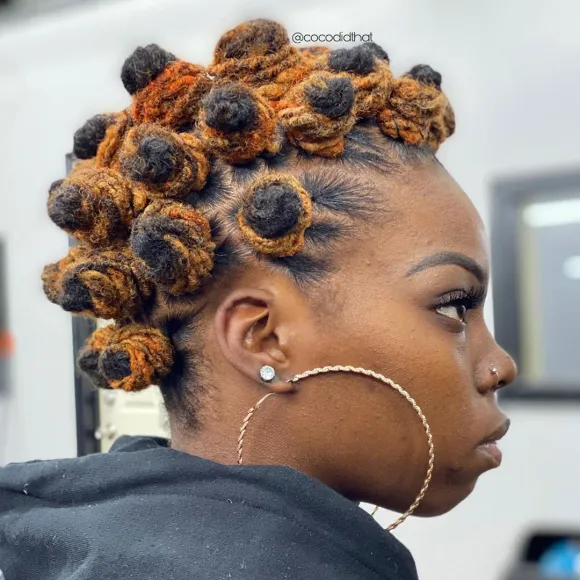 Loc styles for women: Side view of a lady rocking  the bantu knots