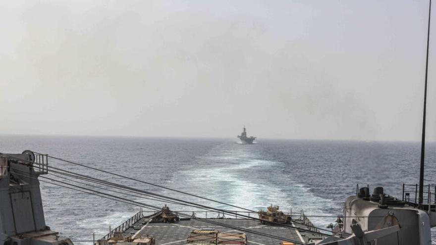 In this image provided by the U.S. Navy, the amphibious dock landing ship USS Carter Hall and amphibious assault ship USS Bataan transit the Bab al-Mandeb strait on Aug. 9, 2023. The top commander of