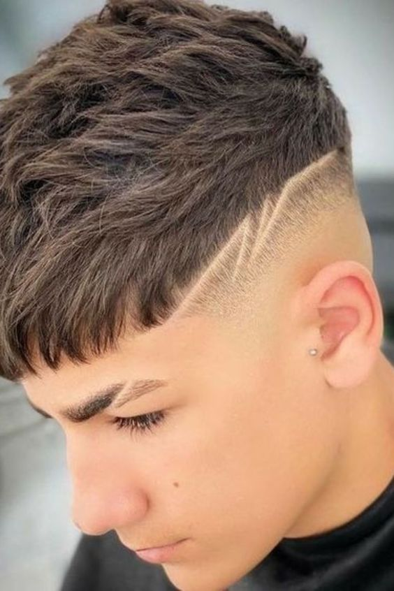 Picture a guy rocking a cool haircut with some stylish lines