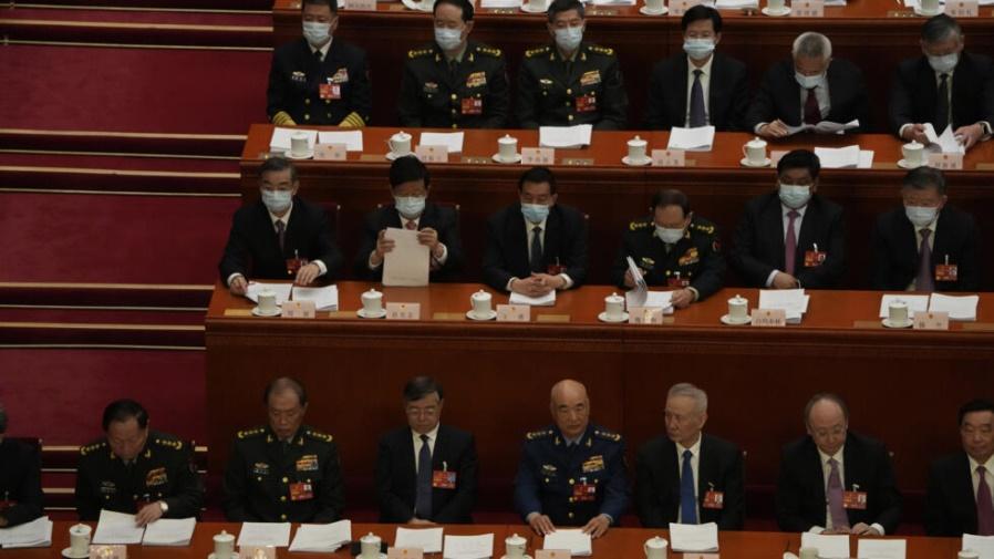 China's top military officials attend the opening session of China's National People's Congress (NPC) at the Great Hall of the People in Beijing, Sunday, March 5, 2023. China on Sunday announced a 7.2