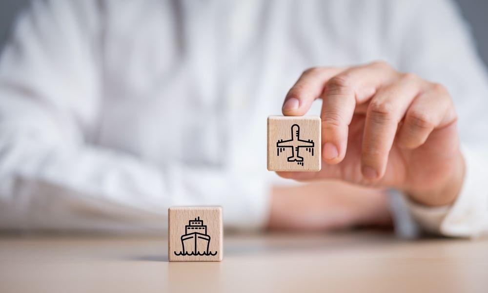 Man holding wooden cubes with shipping options icons
