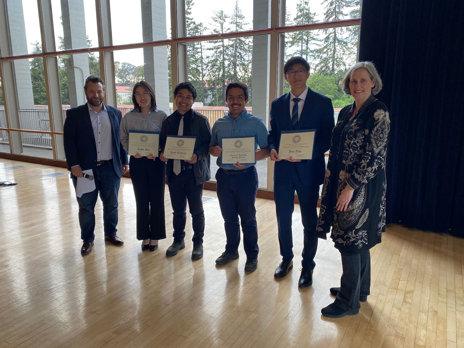 Chair Joan Walker (far right) and CEE Professor Dimitrios Konstantinidis (far left) present Robin Kim, Jared Bautista, Emanuel Arevalo Porras, and Ivan Yan (from left to right) with the Carl W. Johnson Student Leadership Award. (Photo Credit: Erin Leigh Inama).