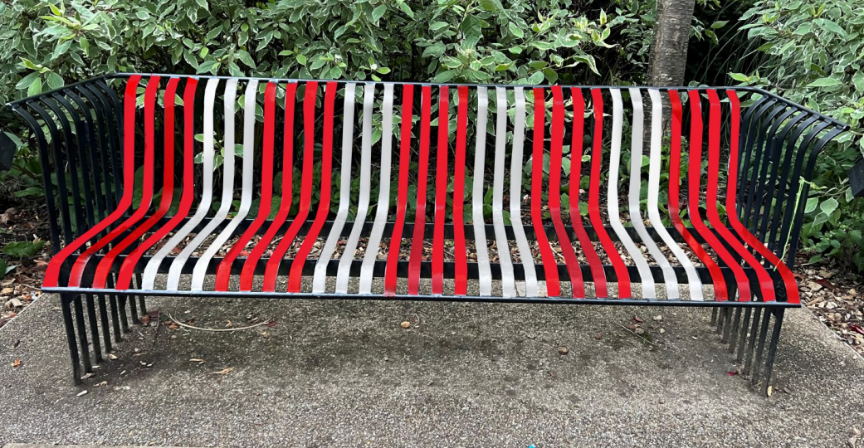 A red and white striped bench

Description automatically generated