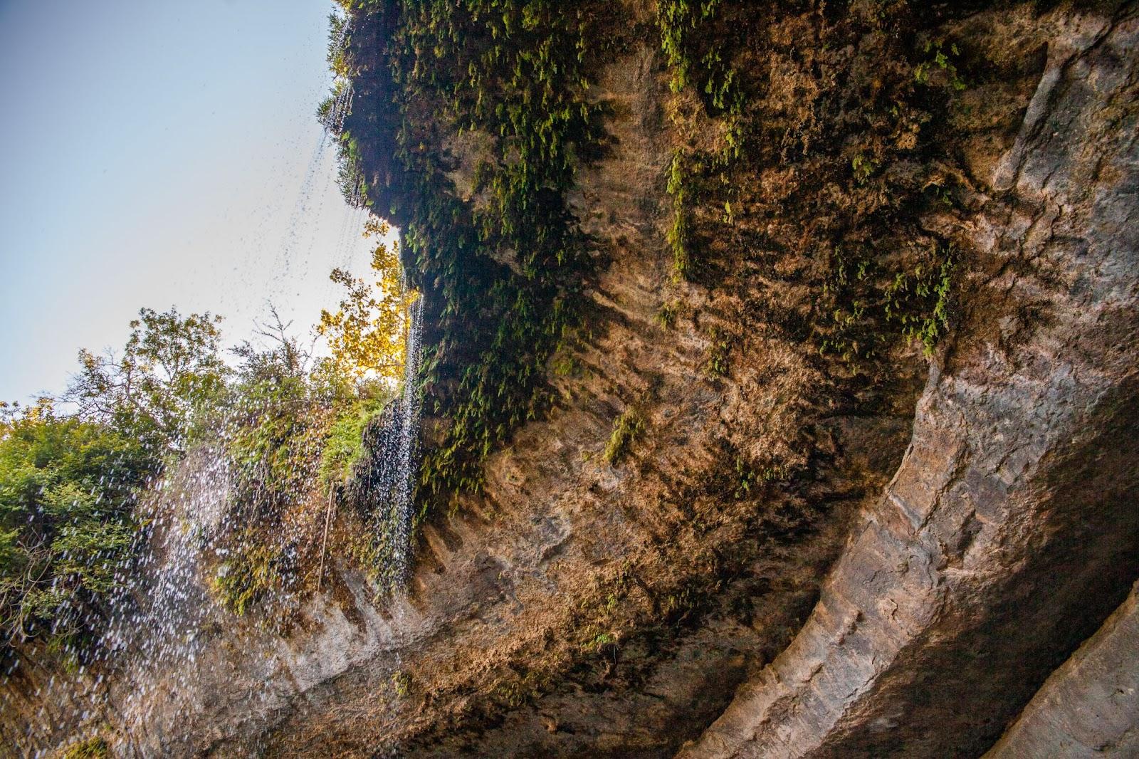 a waterfall on a cliff