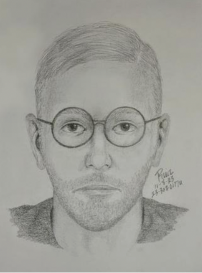 A charcoal sketch of an individual with glasses and facial hair.