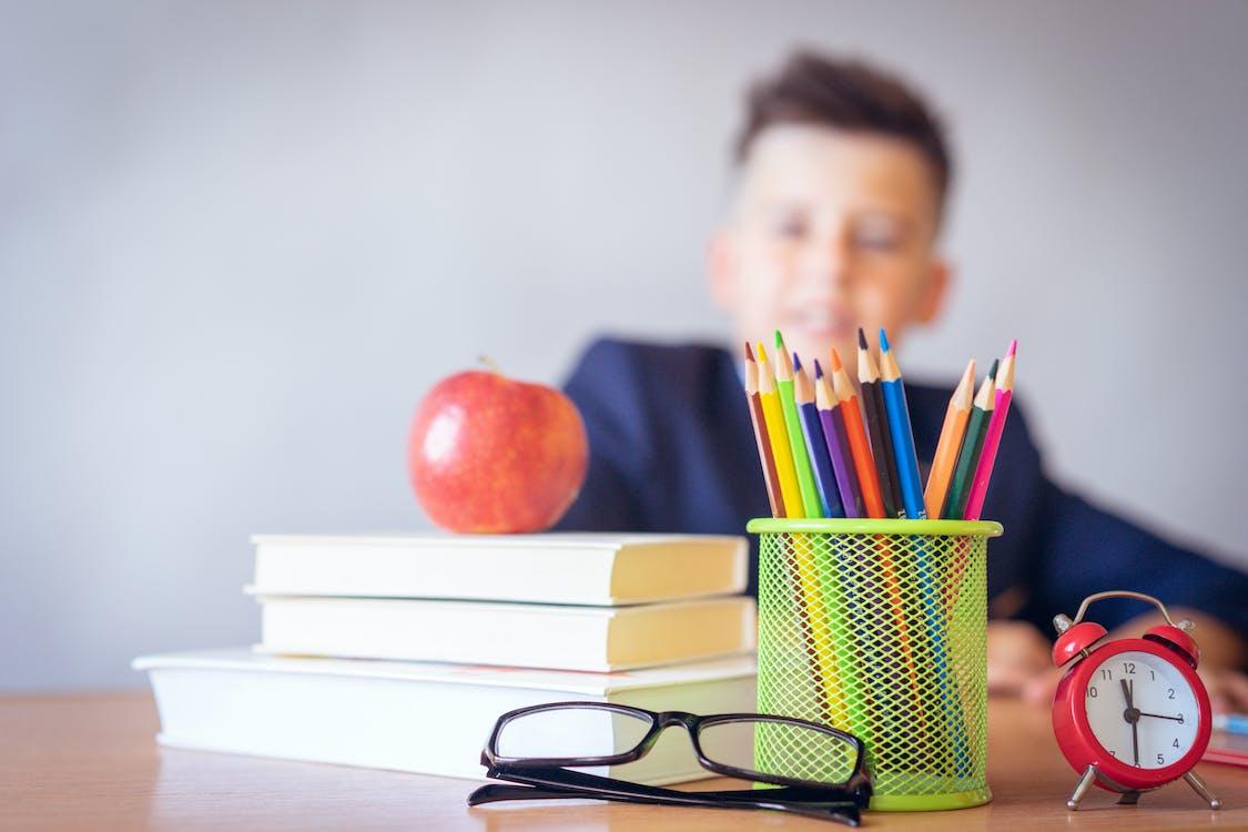 Free Boy Looking On A Tidied Desk  Stock Photo