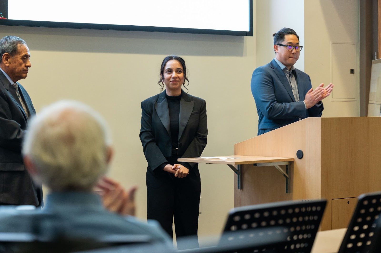 USC Ross Program participants show a presentation with a screen and podium in a lecture-style room
