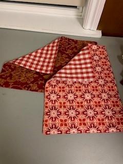 A red and white checkered tablecloth

Description automatically generated