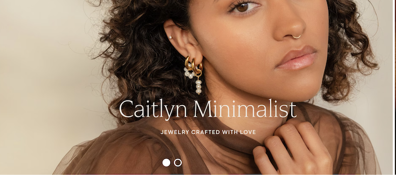 Homepage of an Etsy jewelry store that’s crushing it. We see a girl wearing lots of pretty earrings.