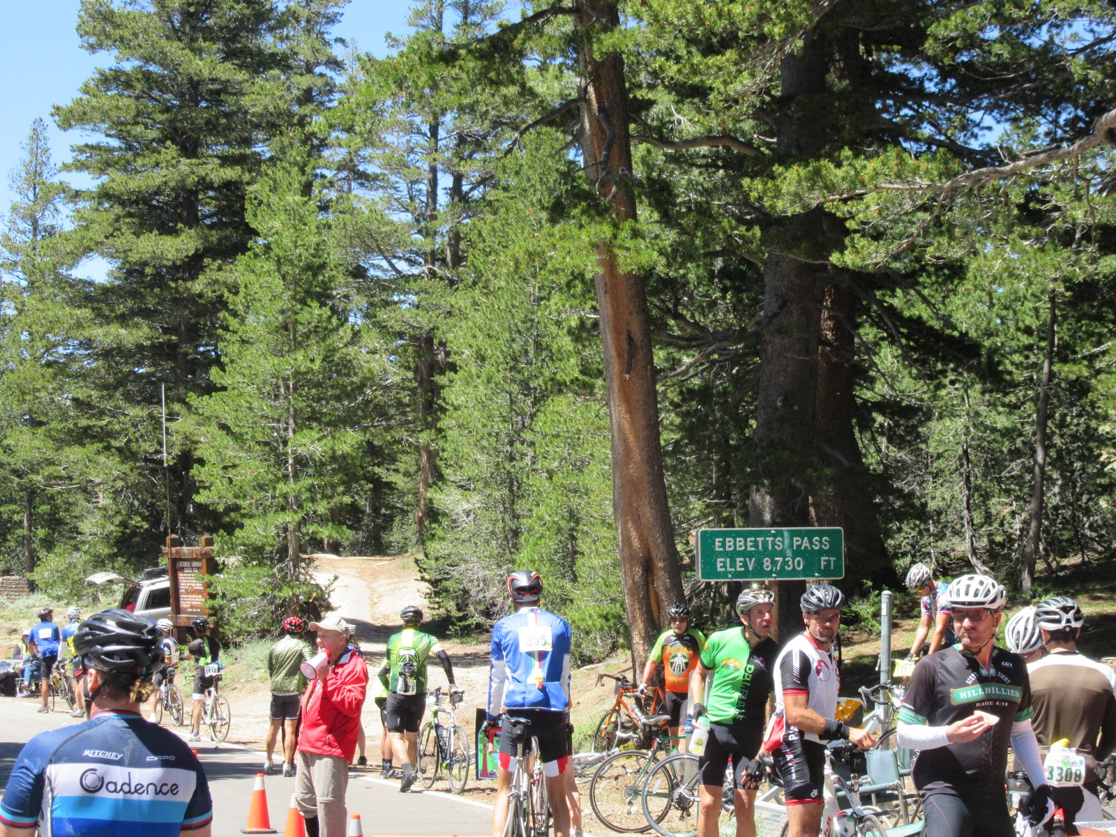 Cyclists congregate next to sign for Ebbetts Pass, Death Ride