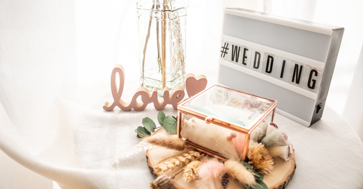 Wedding decoration with dry flowers on a white background and a light box with the hashtag #wedding