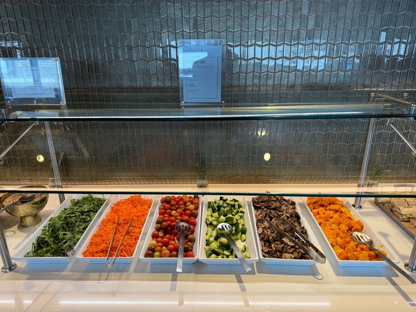 The salad bar in the sfo polaris lounge with a generous spread of vegetables