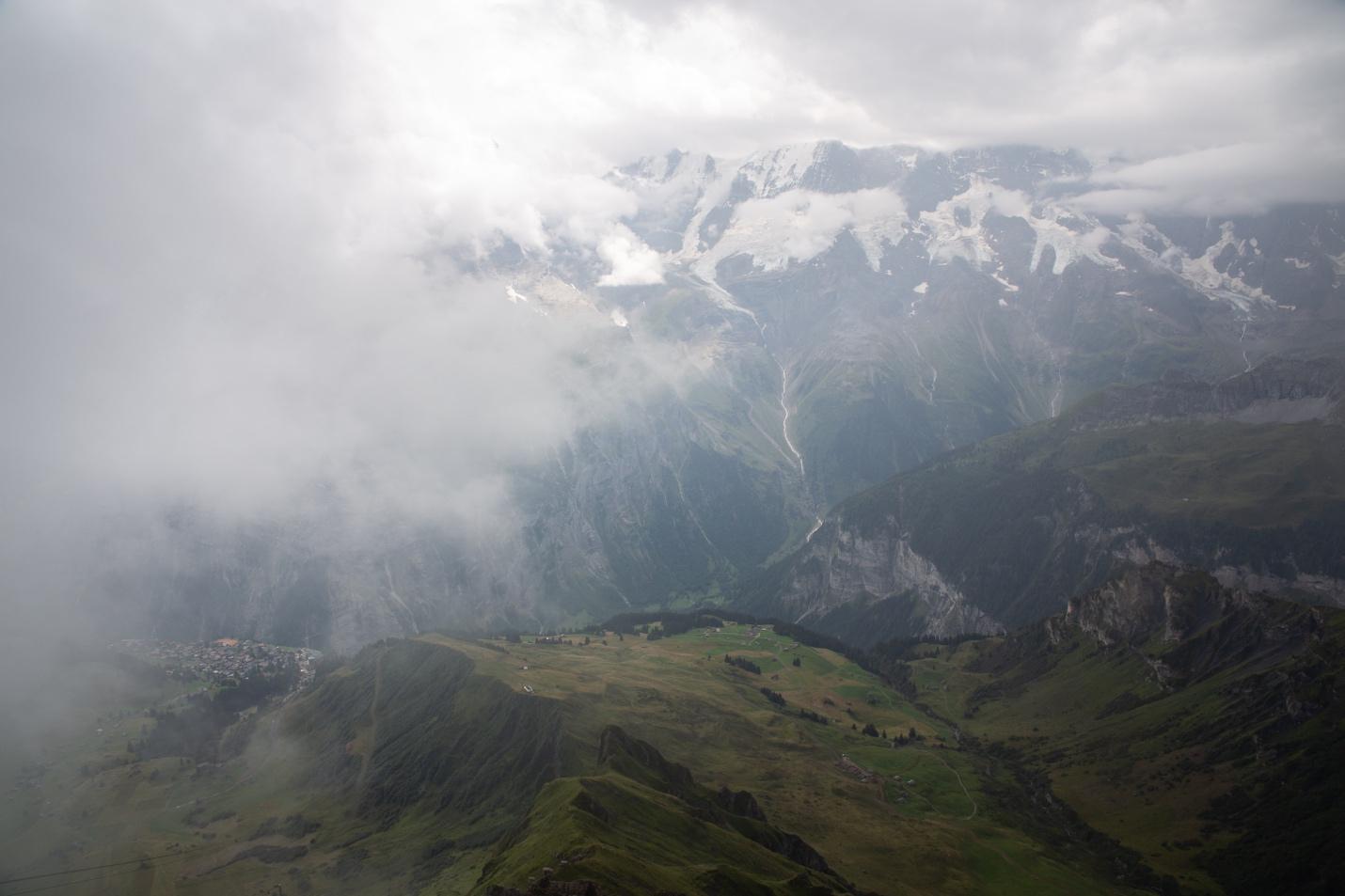 A mountain range with clouds

Description automatically generated