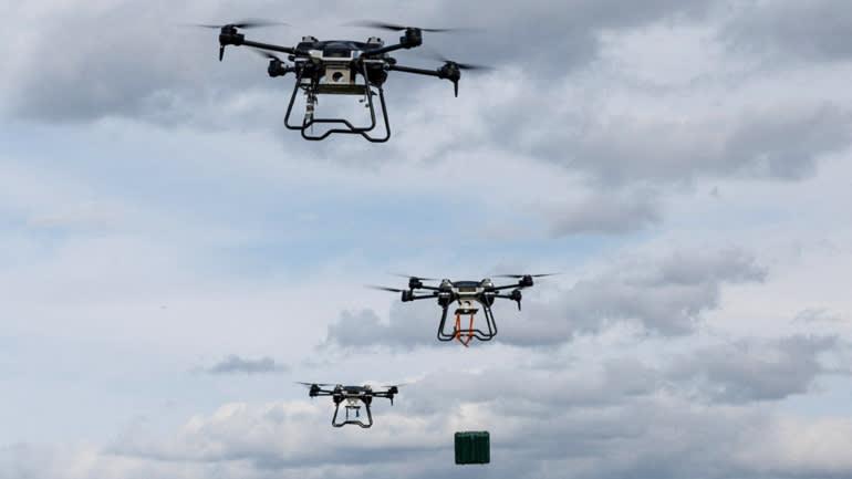 A group of drones flying in the sky