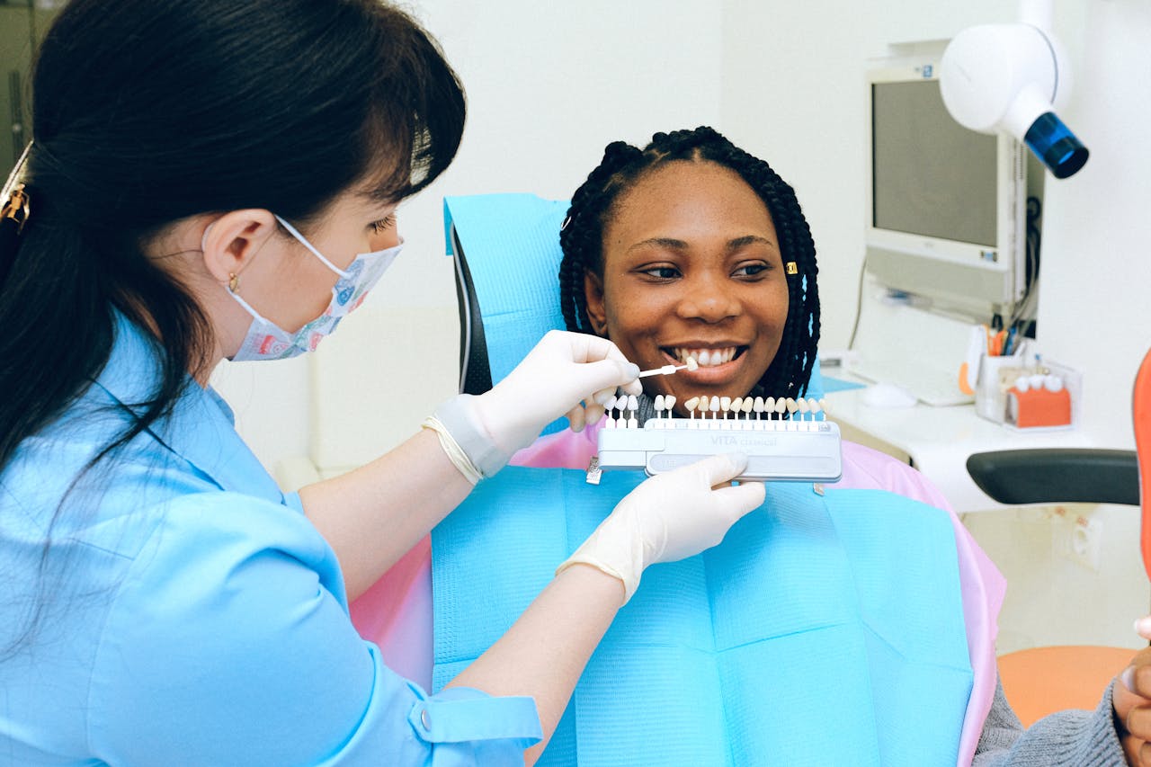 Dentist fitting patient's teeth