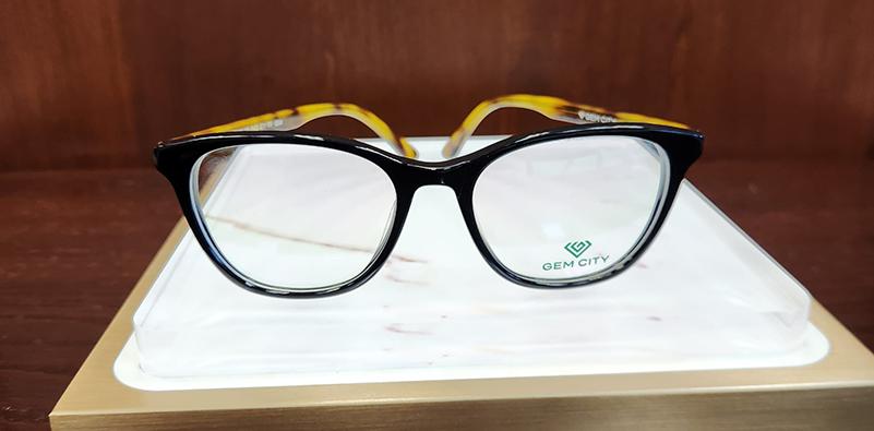 Oak pair of glasses on a shelf