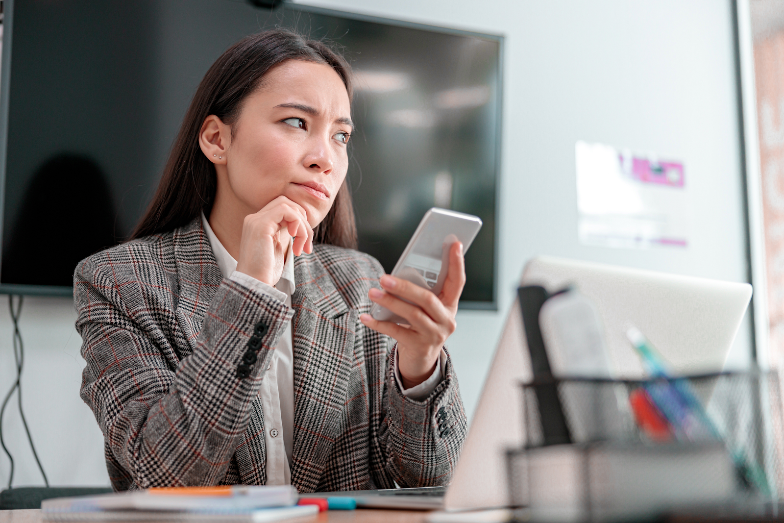 woman reading an SMS message on her phone