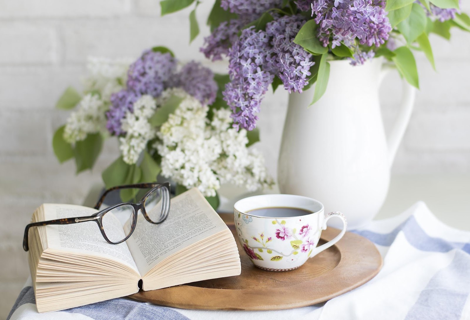 Book, flowers, and coffee.