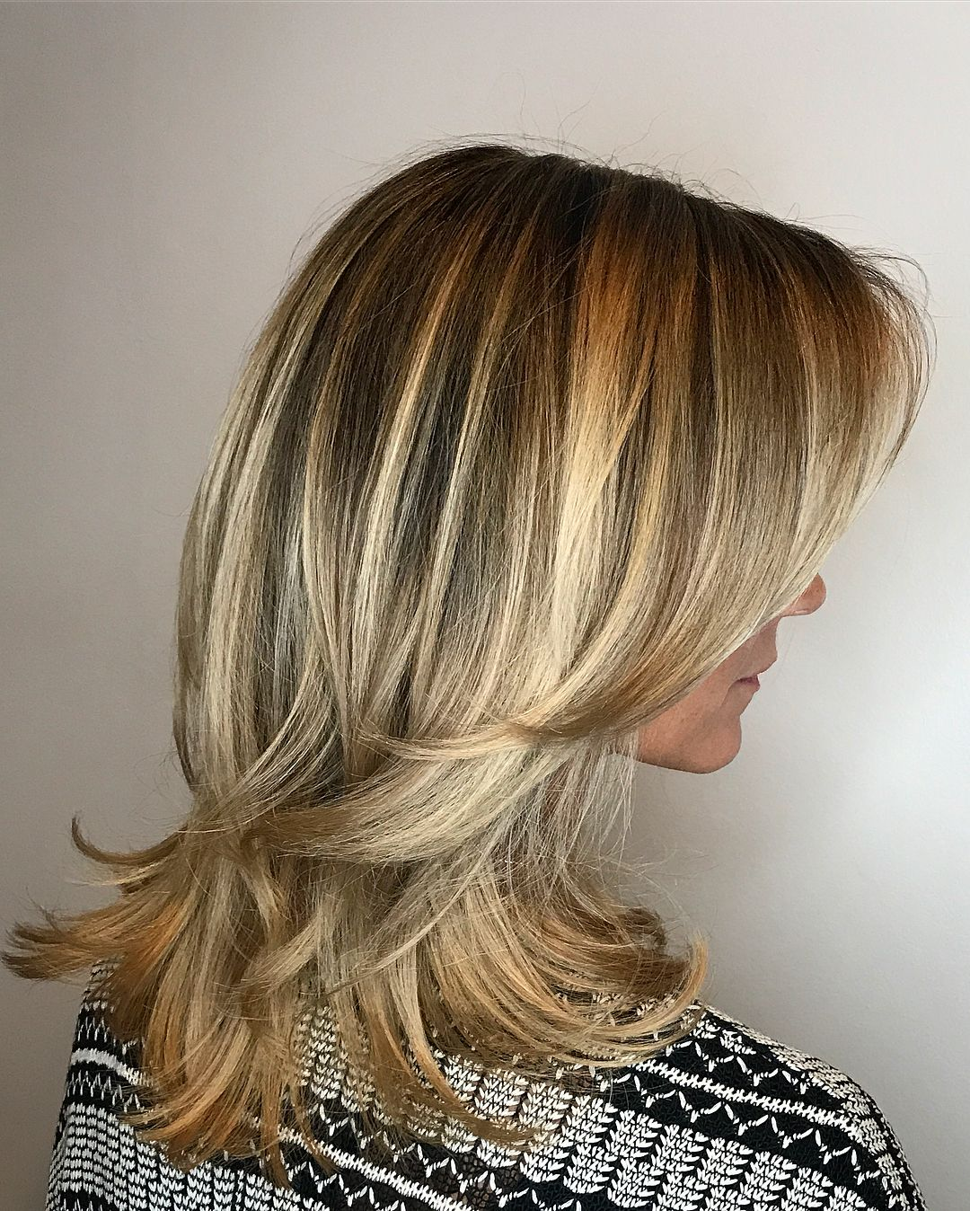  Medium Blonde Hairstyle with Flicked Ends