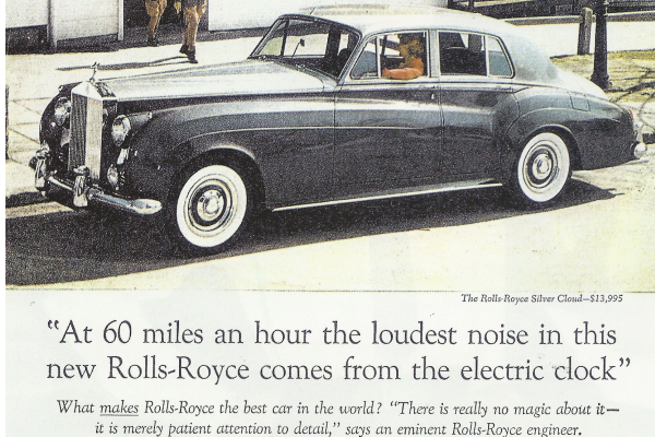 "At 60 miles an hour the loudest noise in this new Rolls-Royce comes from the electric clock"