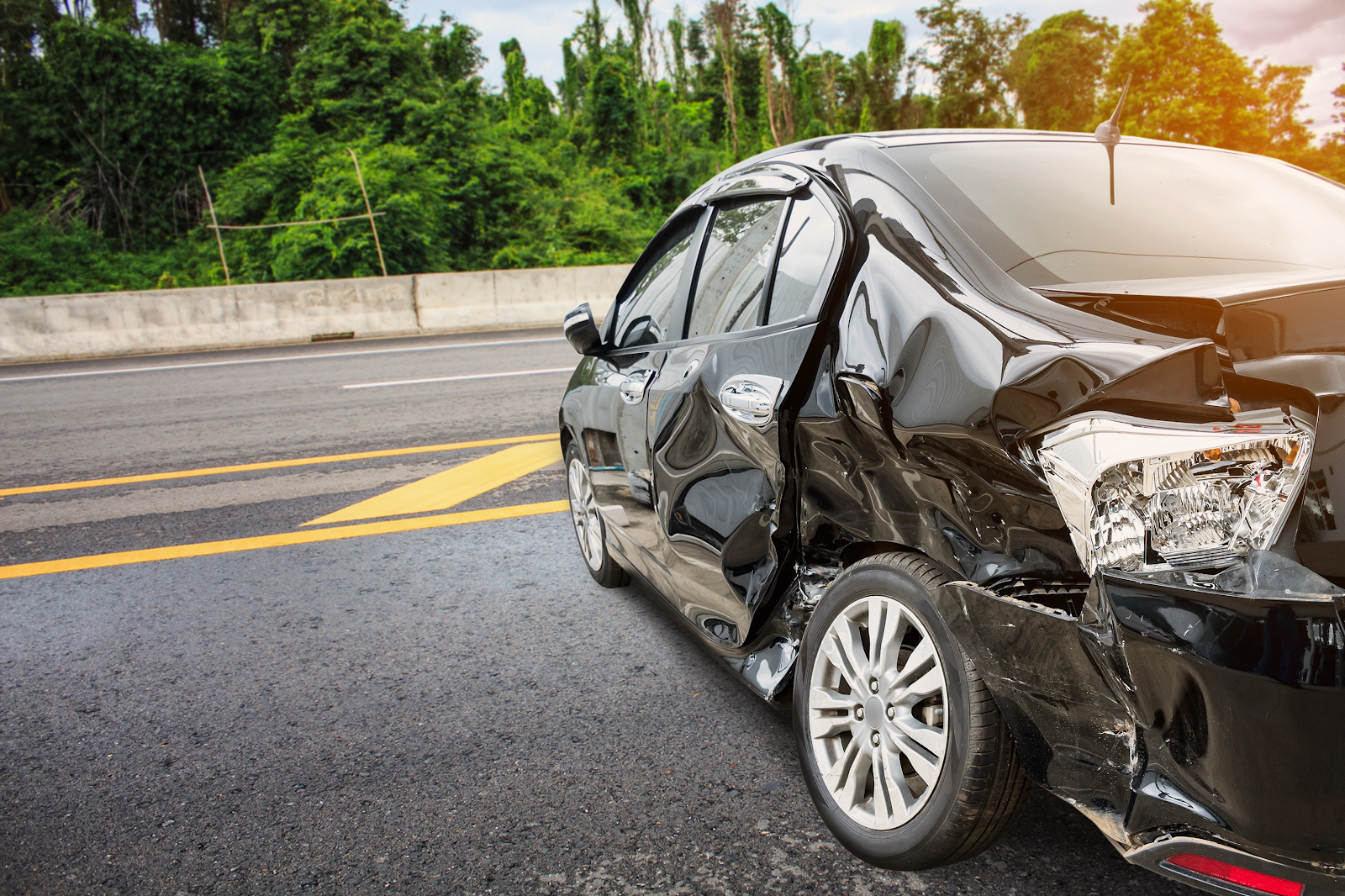 A car accident scene with a personal injury lawyer assessing the situation