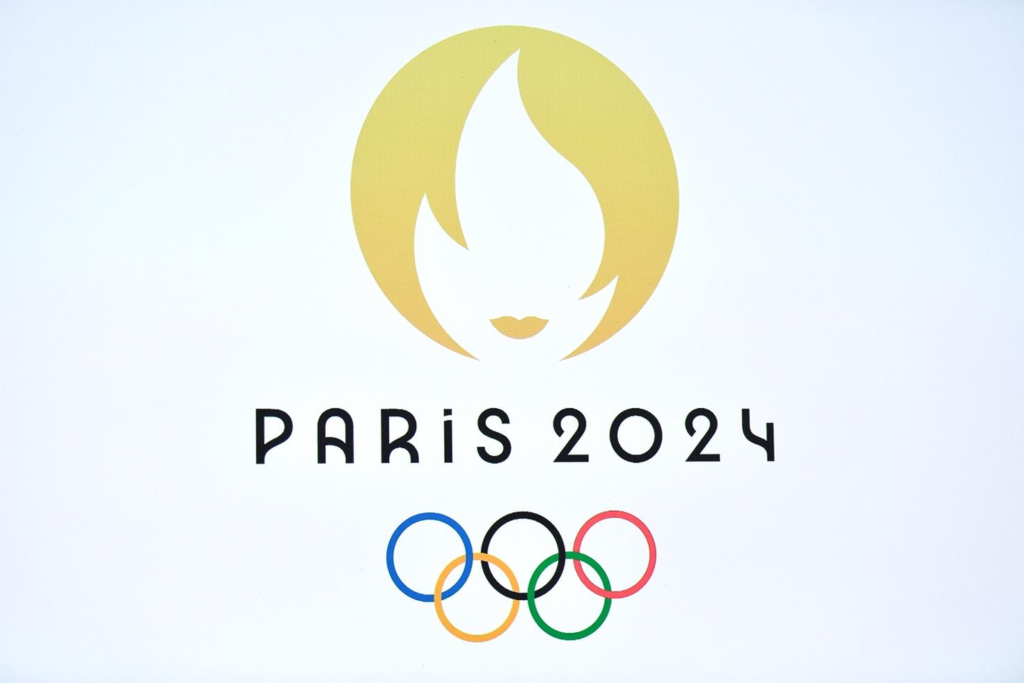 A logo with a flame and rings

Description automatically generated