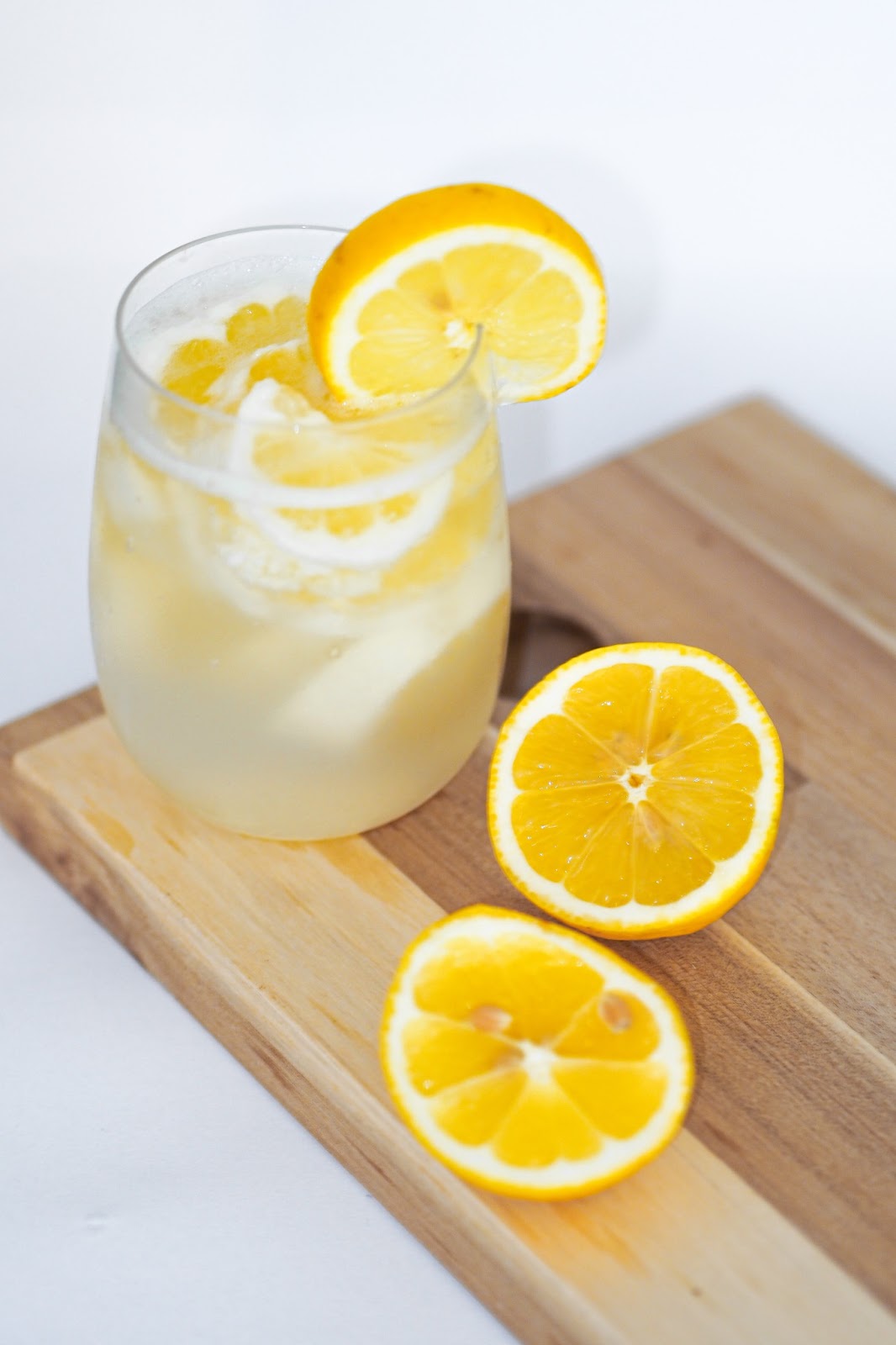 A glass of fresh lemon water to hydrate during travel. 