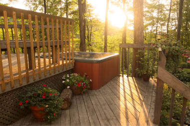 benefits of adding a new deck to your home hot tub area with potted plants custom built michigan