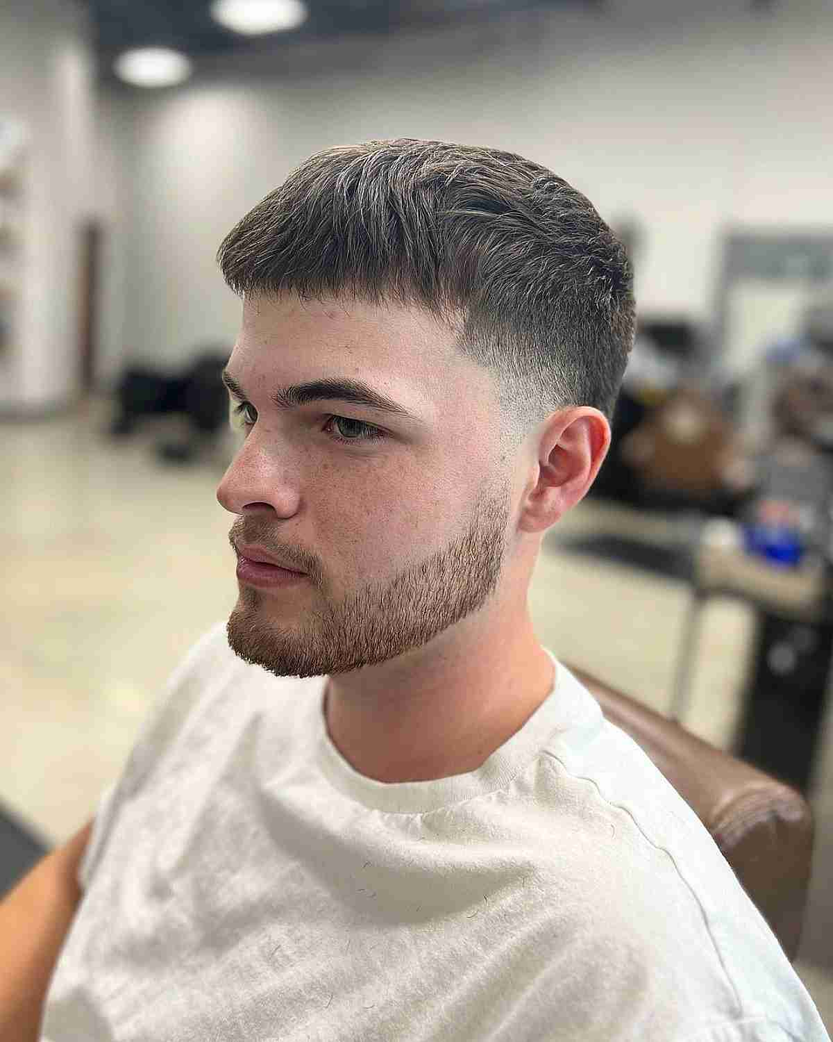 Faded Haircut With Low Taper and Short Fringe