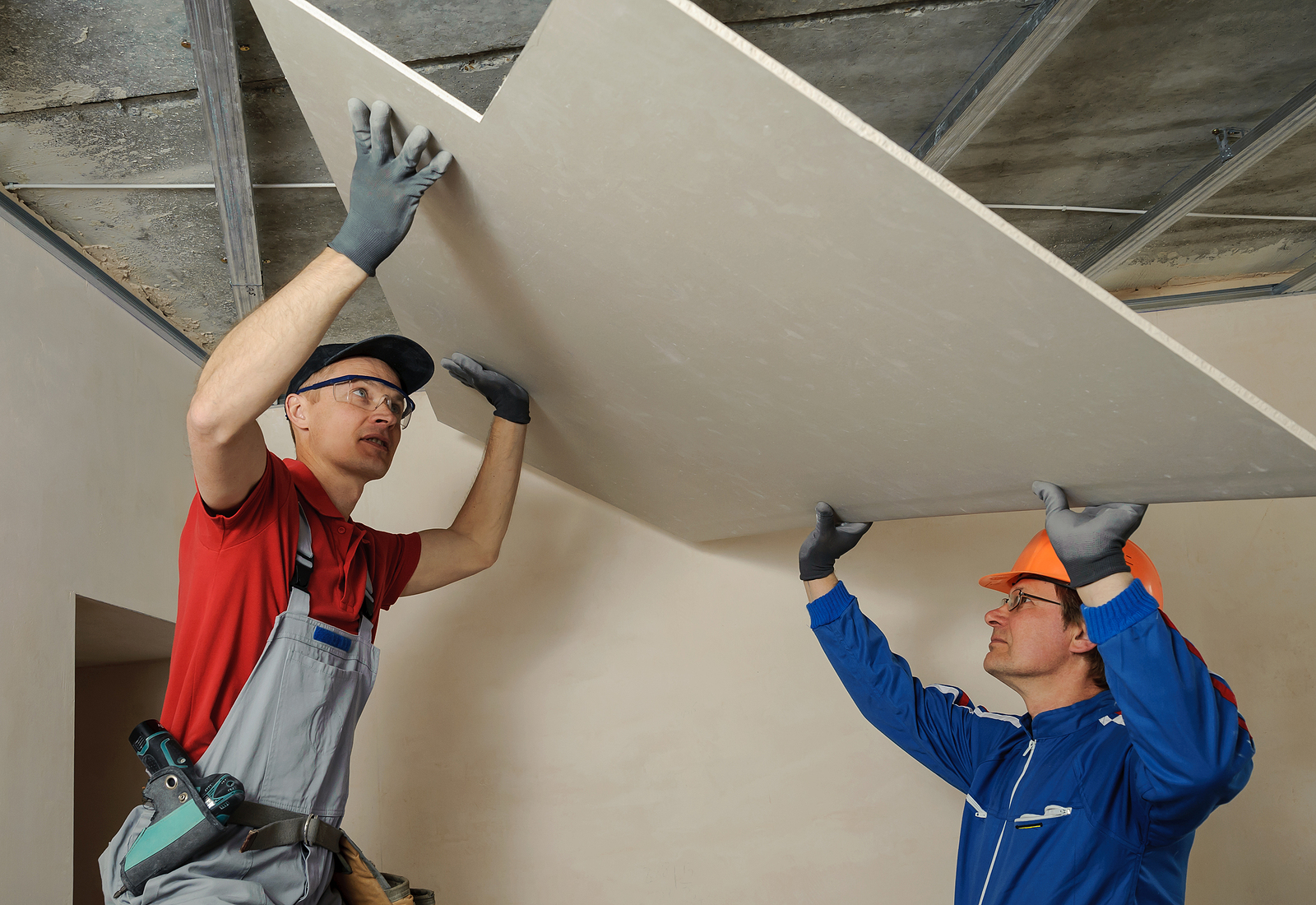  Men working drywall contractor in Wisconsin