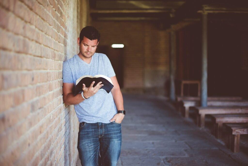 man reading a book - How To Improve Study Habits