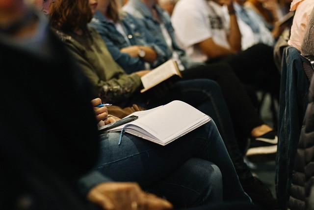 Multiple students taking notes at a lecture hall - How to Bounce Back From a Bad Grade 