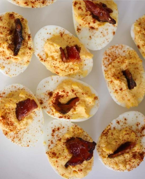 Devil deviled eggs with bacon and spices

Description automatically generated