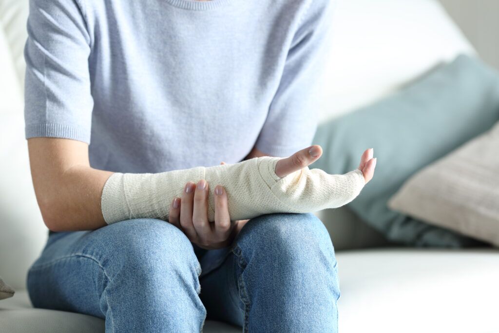 personal injury victim with their arm and wrist wrapped in a bandage.