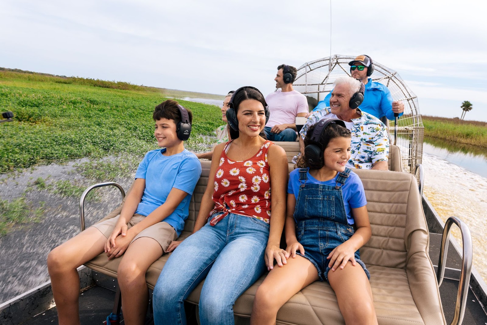 A family enjoys an airboat tour at the Florida Everglades