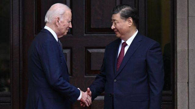 US President Joe Biden greets Chinese President Xi Jinping before a meeting during the Asia-Pacific Economic Cooperation (APEC) Leaders' week in Woodside, California on November 15, 2023