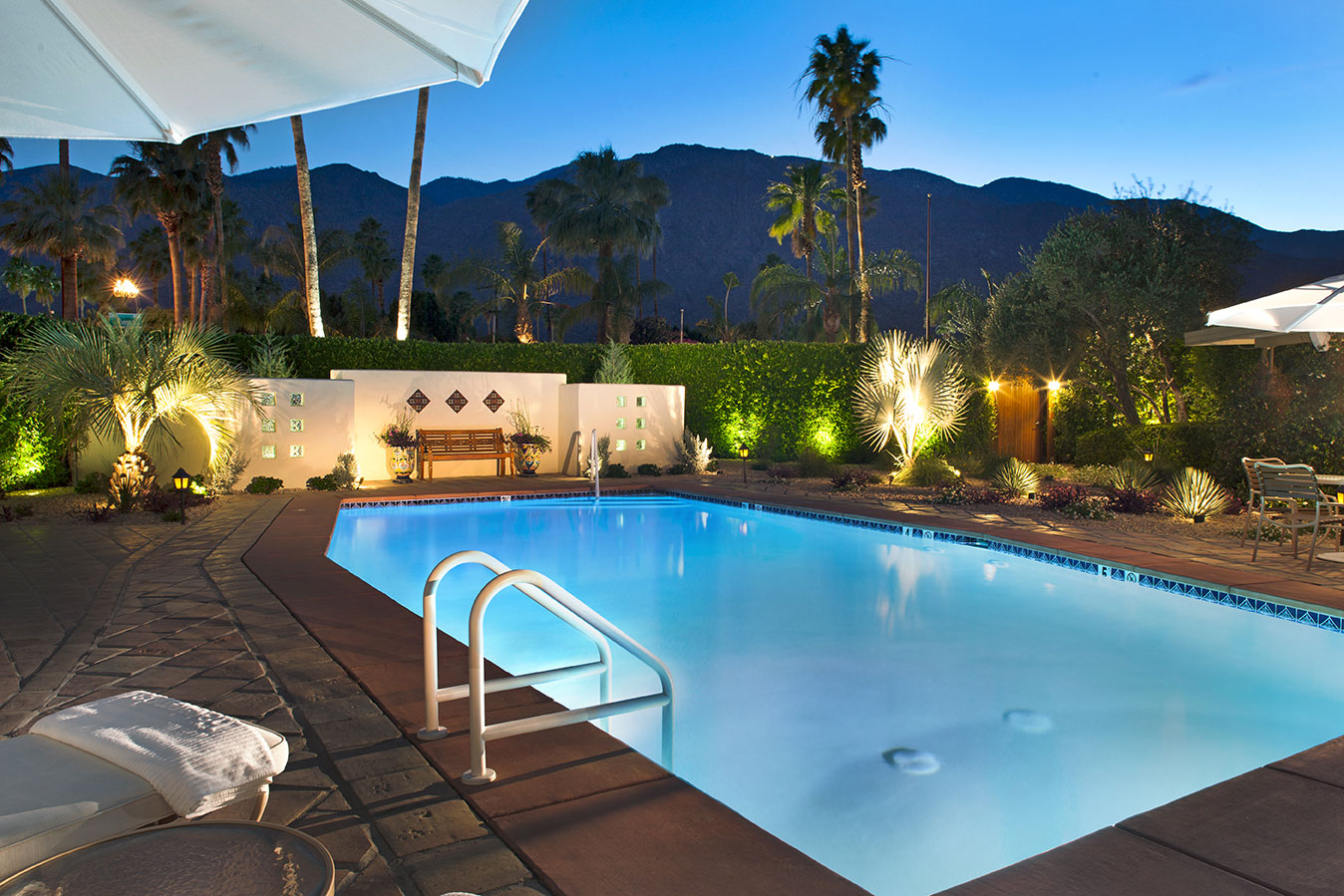 outdoor pool and lounge area for premium gay male clothing optional resort The Hacienda at Warm Sands located in palm springs california