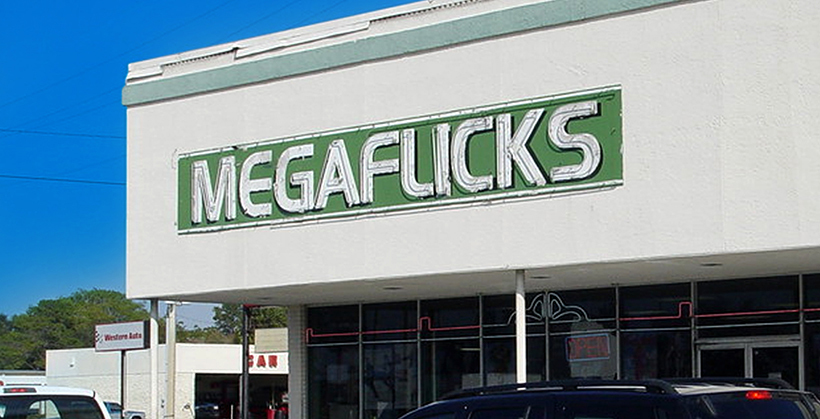 Megaflicks logo on the side of a building