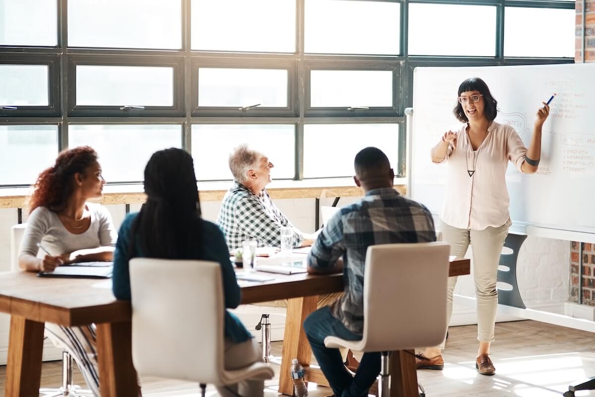 HR pain points: entrepreneur presenting at a meeting