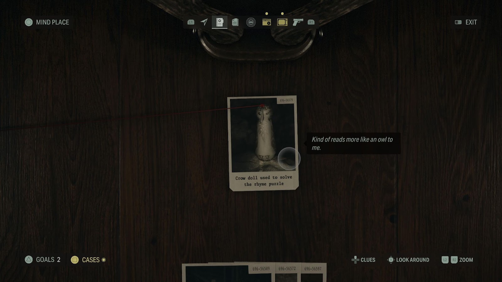 An in game screenshot of the crow doll on Saga's Case Board from Alan Wake II.