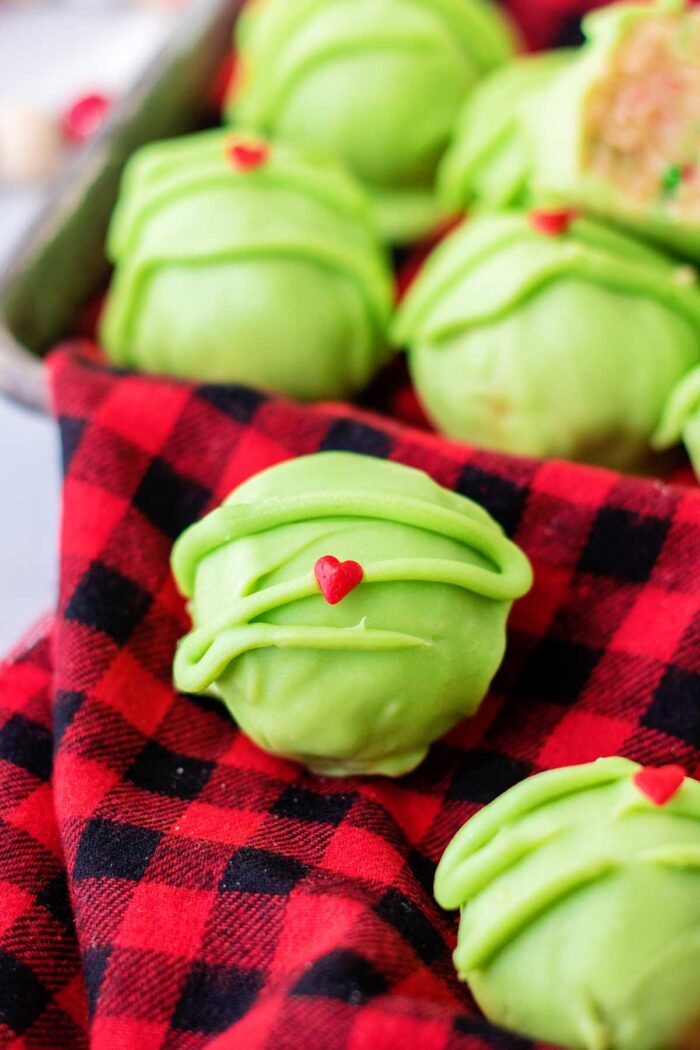 sugar cookie truffles grinch theme on red and black check napkin