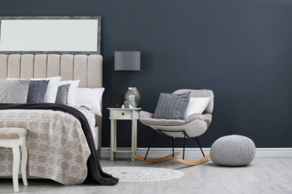 Grey bedroom with accent chairs